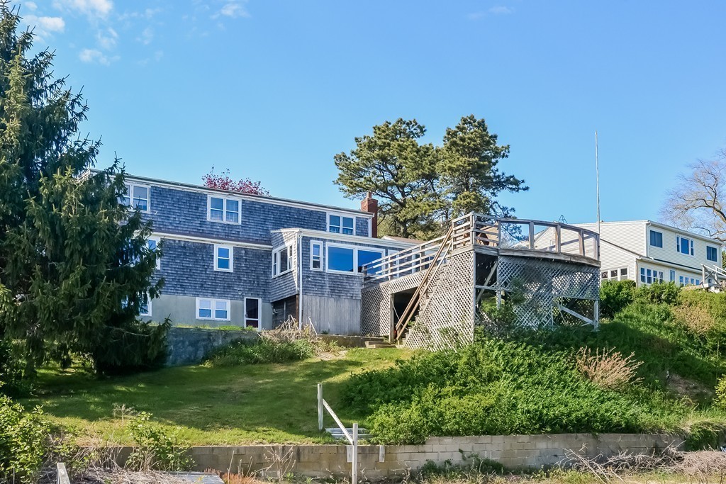 51 Pine Ridge Road Bourne, MA 02532 - Photo 2 of 25 front view of a building with a garden