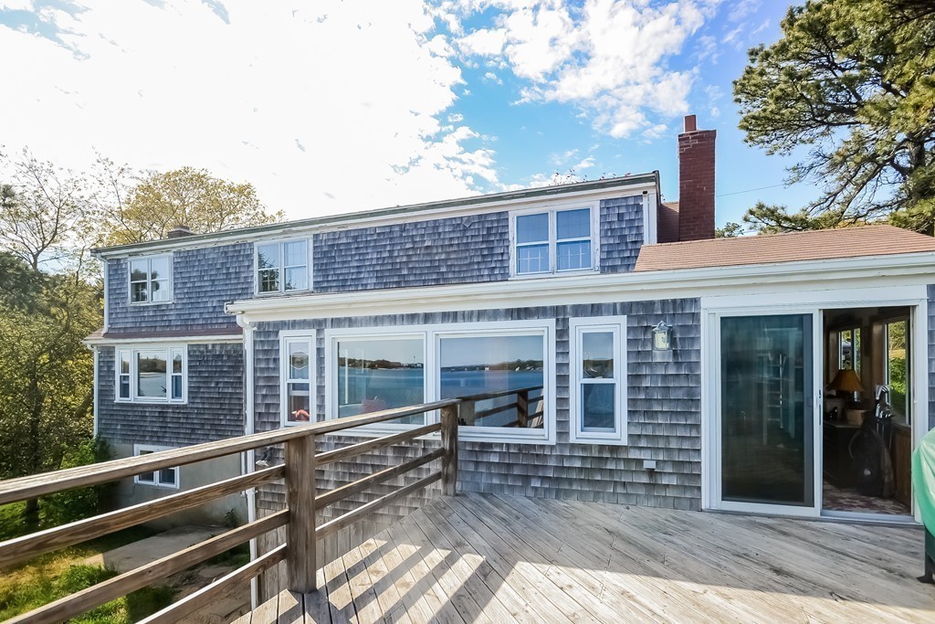 51 Pine Ridge Road Bourne, MA 02532 - Photo 22 of 25 a view of a brick house with many windows