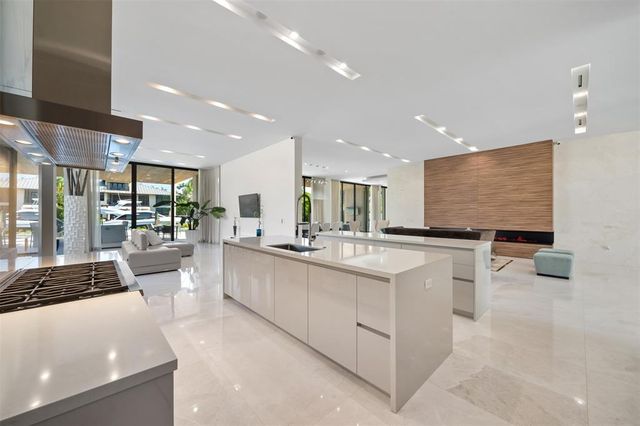 a utility room with cabinets washer and dryer