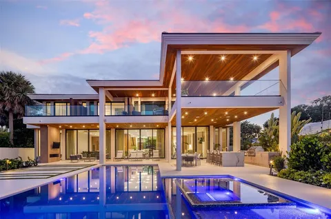 a view of house with a yard and patio