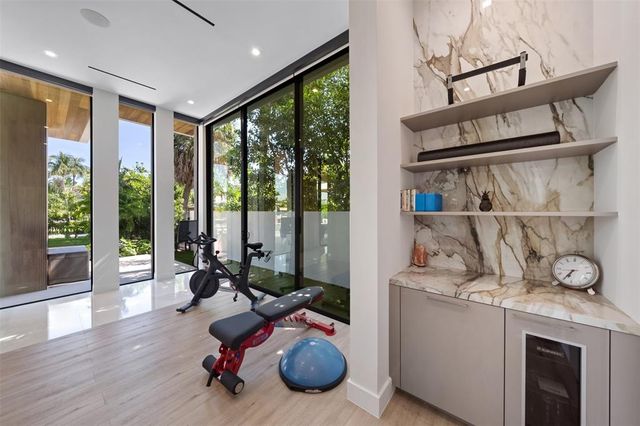 an aerial view of a house with garden space and street view