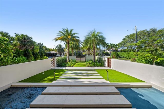 a living room with furniture and windows