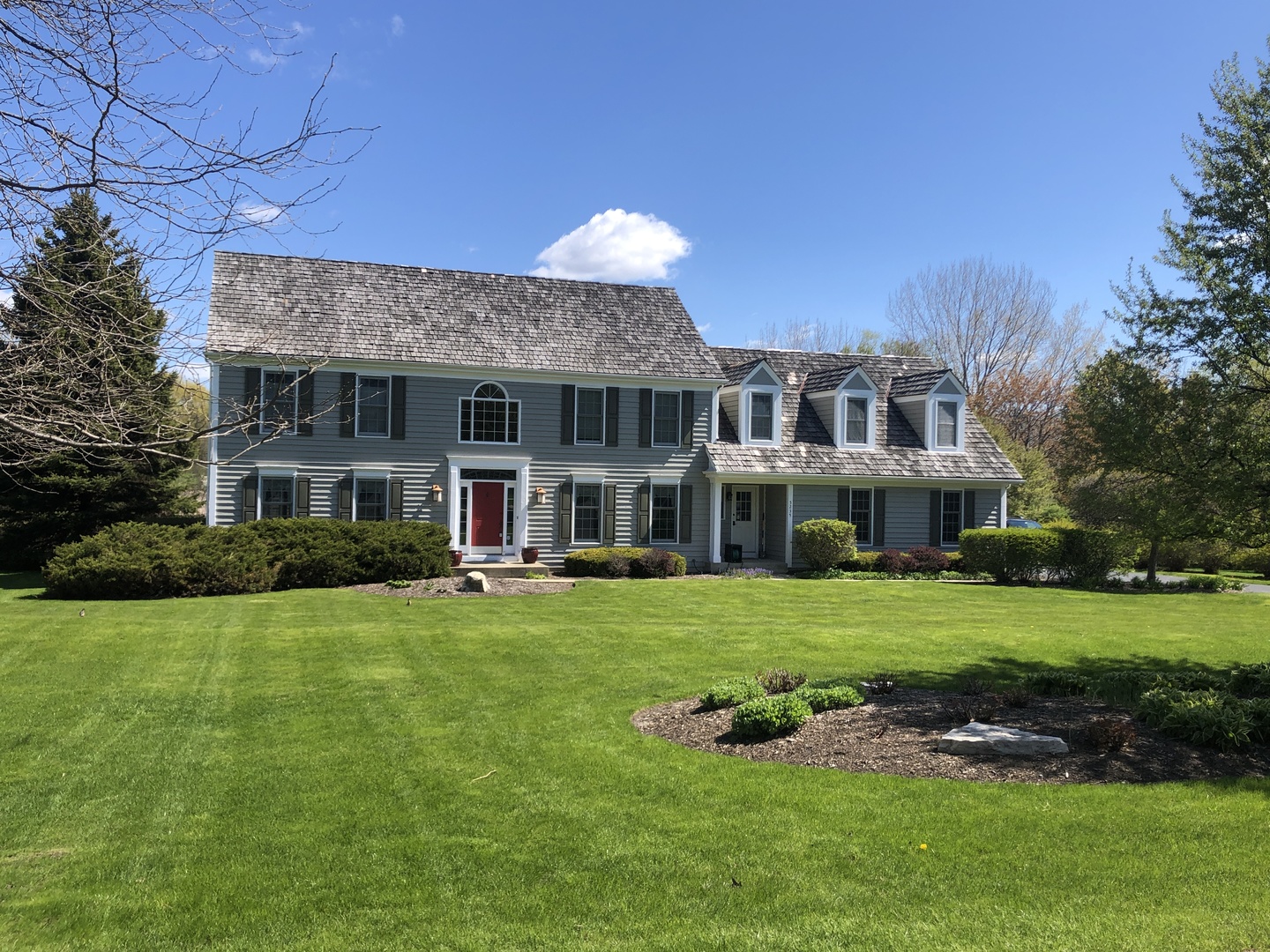 5235 Hilltop Road Long Grove, IL 60047 - Photo 14 of 20 a front view of a house with a garden