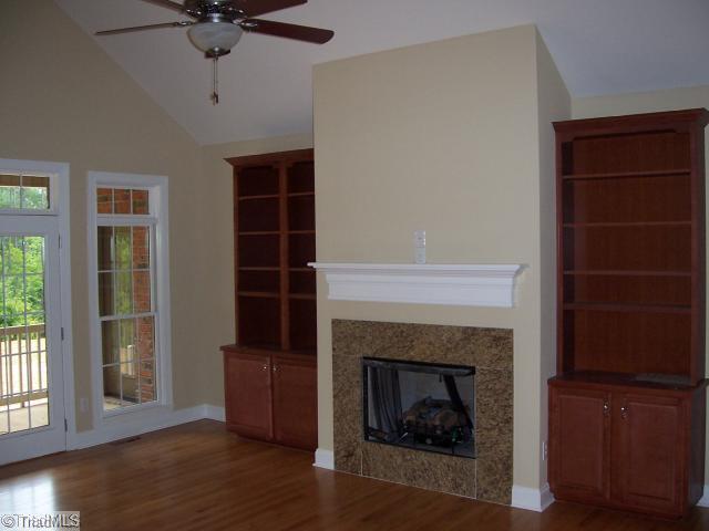 4174 Beckerdite Road Sophia, NC 27350 - Photo 2 of 8 Living Room. Gas fireplace, built-in bookcase, hardwood floors.