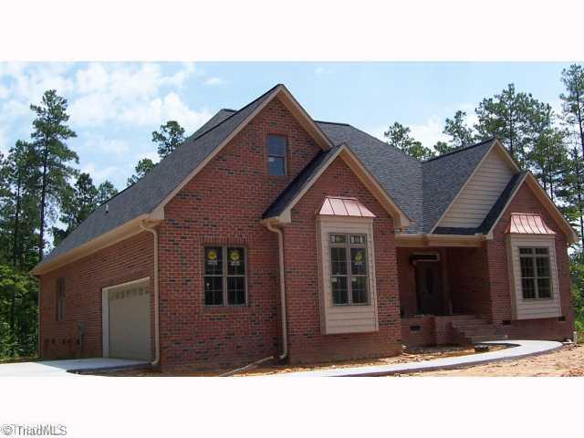 4174 Beckerdite Road Sophia, NC 27350 - Photo 3 of 8 Exterior Front. Large garage, storage space. Poured cement drive and turn-around area.