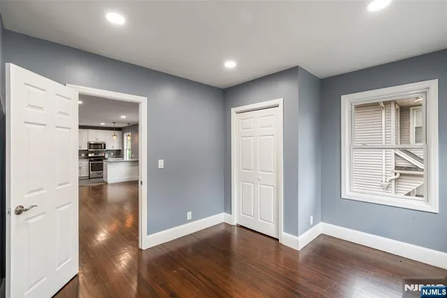 a view of livingroom with hardwood floor and hallway