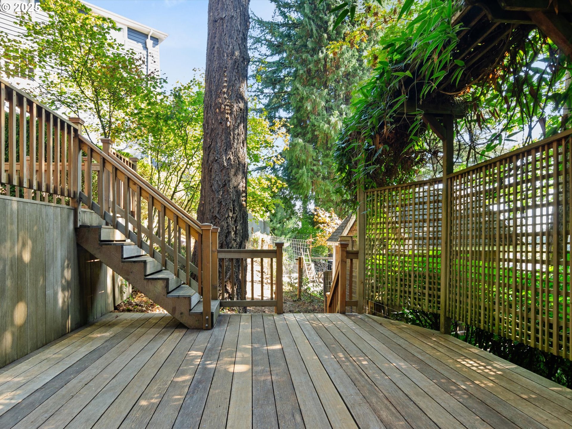 2917 Southwest Fairview Boulevard Portland, OR 97205 - Photo 19 of 25 a view of outdoor space with wooden floor and fence