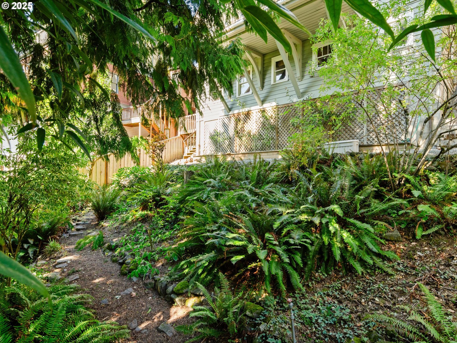 2917 Southwest Fairview Boulevard Portland, OR 97205 - Photo 23 of 25 a backyard of a house with lots of green space