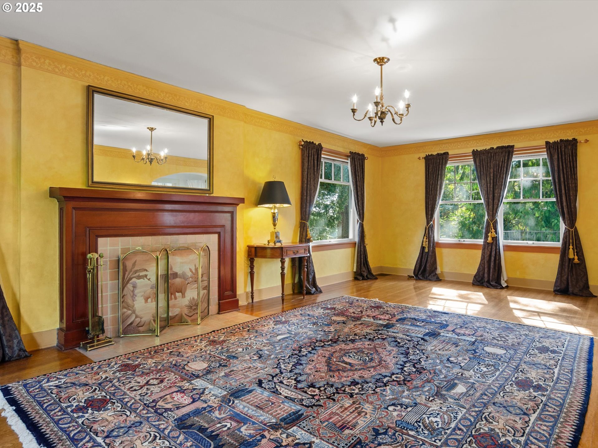 2917 Southwest Fairview Boulevard Portland, OR 97205 - Photo 4 of 25 a bedroom with a bed and a fireplace