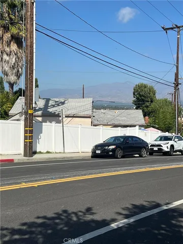 a view of street with parked cars