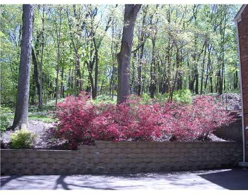 302 Wildberry Road Fox Chapel, PA 15238 - Photo 18 of 18 Exterior Front. New driveway and retaining wall flank the mature landscapping and rear/side level lawn.