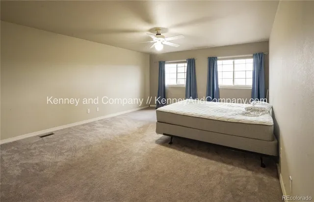 a spacious bathroom with a sink a mirror and a shower