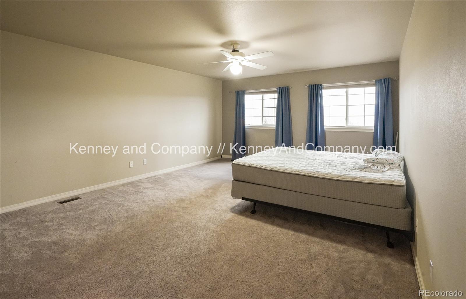 15879 Agate Creek Drive Monument, CO 80132 - Photo 11 of 24 a spacious bedroom with a bed and window