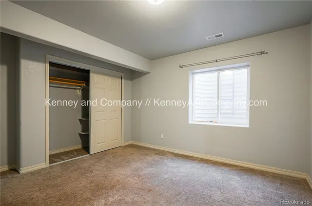 a view of an empty room with a fireplace