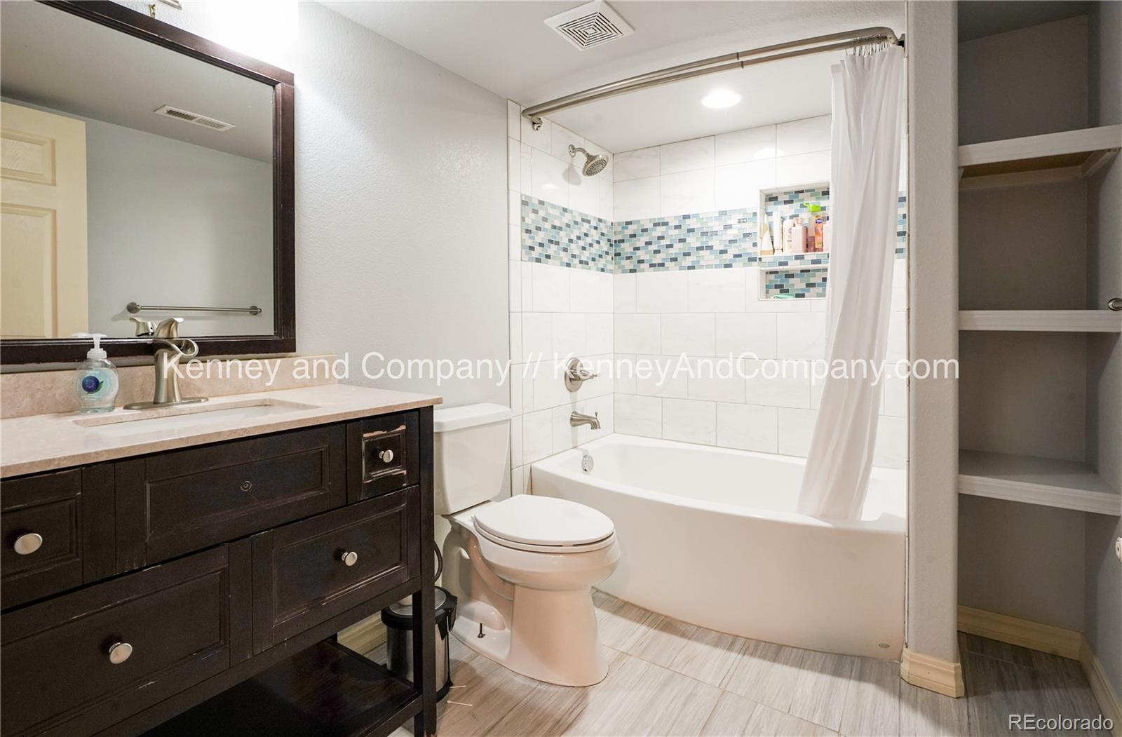 15879 Agate Creek Drive Monument, CO 80132 - Photo 20 of 24 a bathroom with a sink a toilet and shower