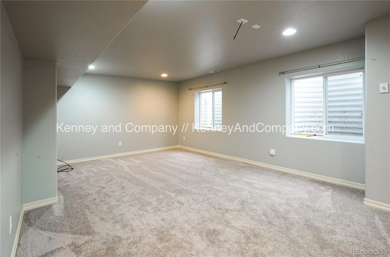 15879 Agate Creek Drive Monument, CO 80132 - Photo 22 of 24 an empty room with wooden floor and windows
