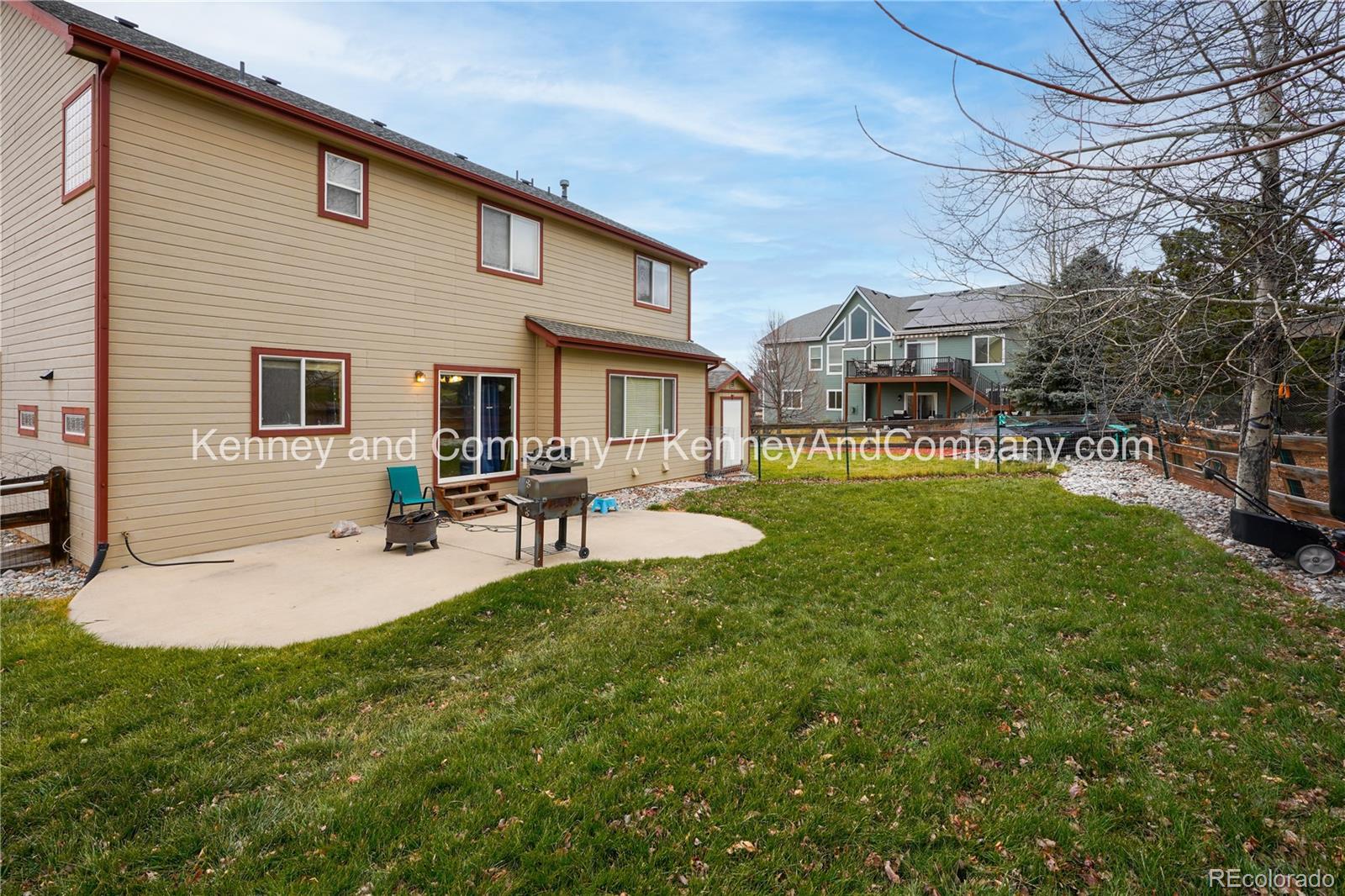 15879 Agate Creek Drive Monument, CO 80132 - Photo 24 of 24 a backyard of a house with table and chairs