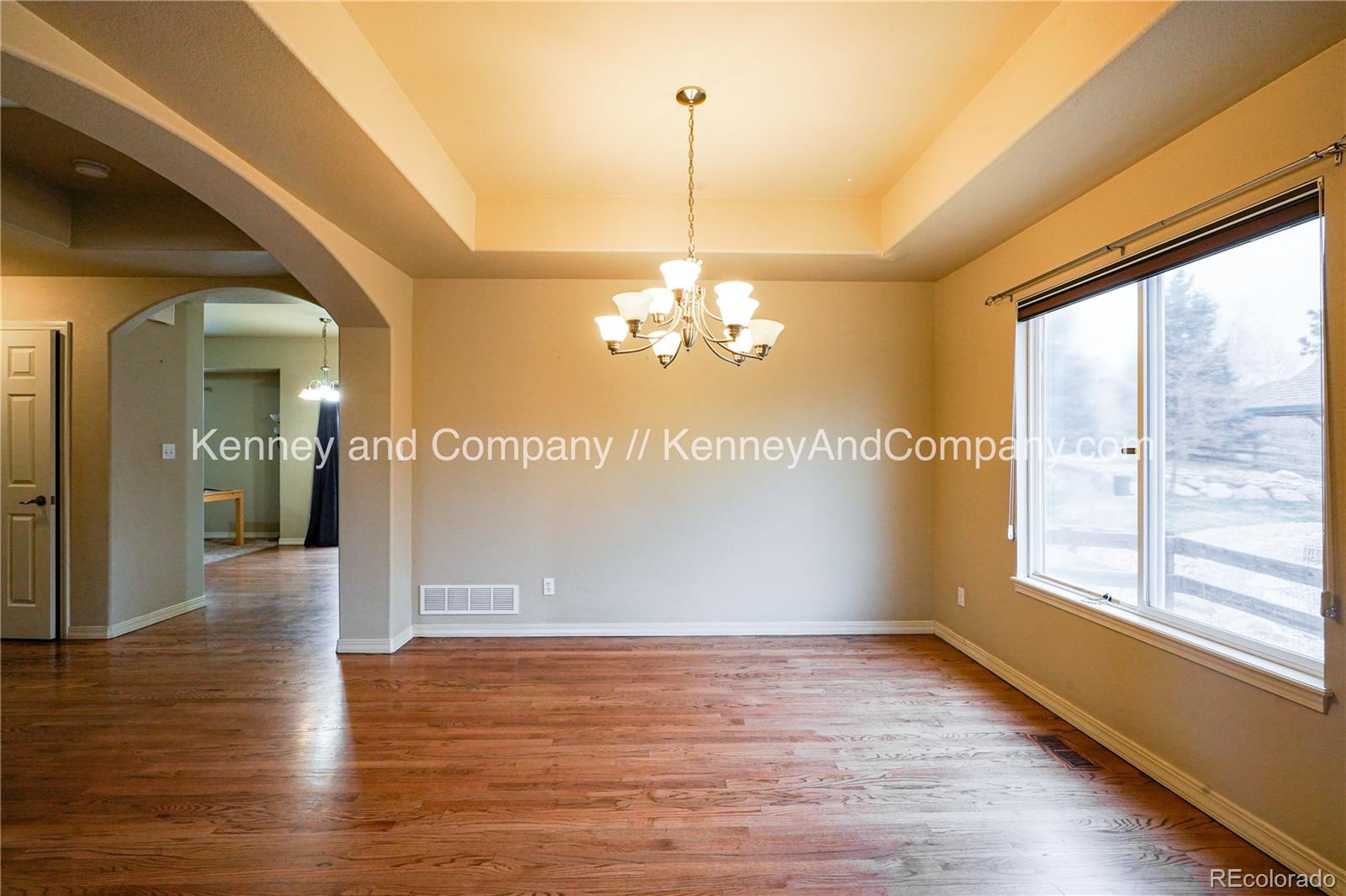 15879 Agate Creek Drive Monument, CO 80132 - Photo 8 of 24 a view of a livingroom with a window and wooden floor