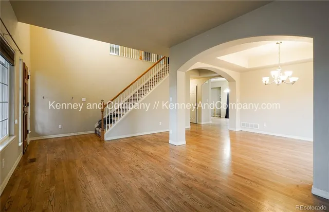 a spacious bathroom with a tub sink and mirror