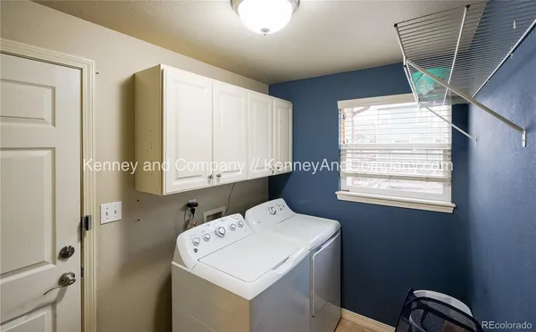 a spacious bedroom with a bed and window