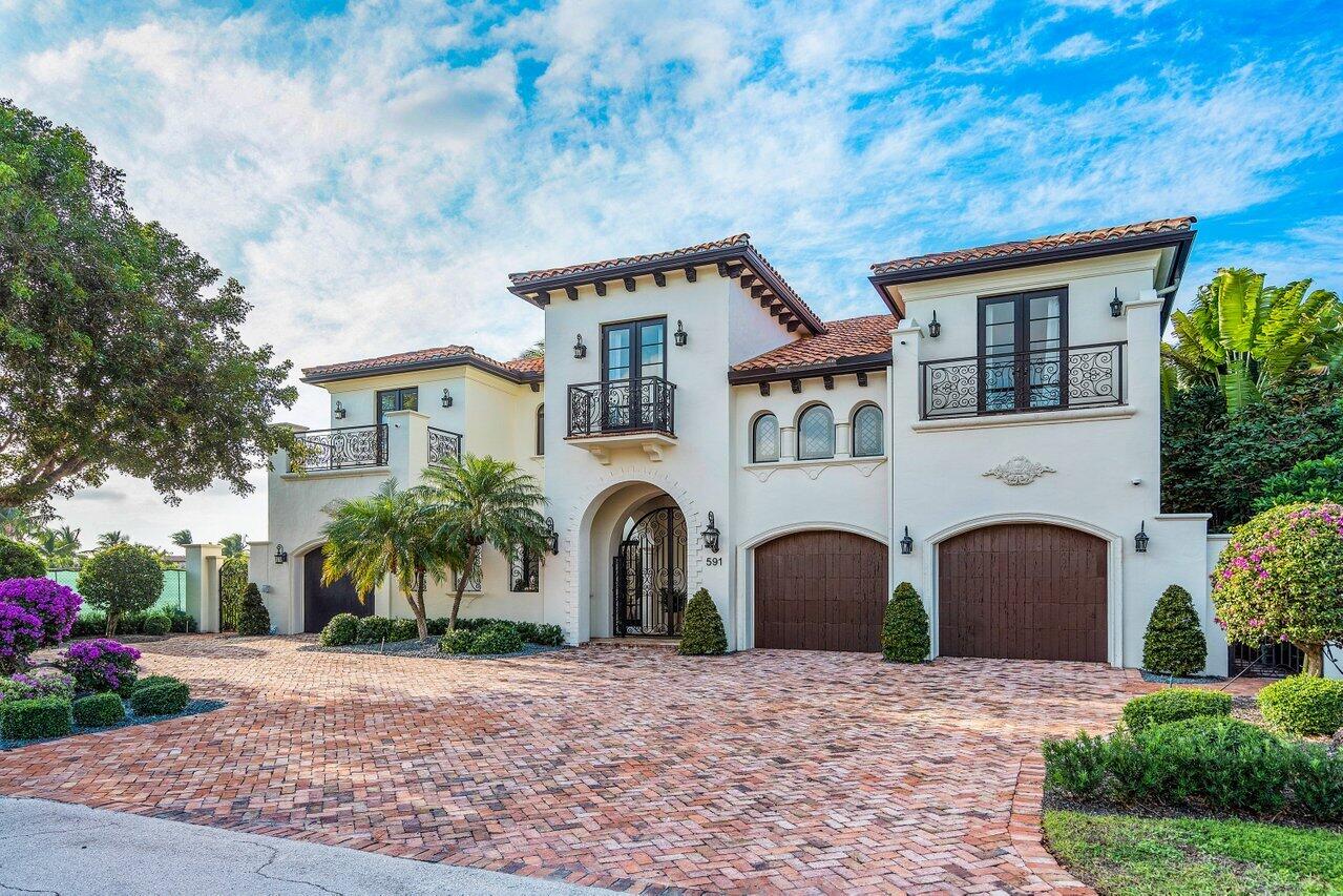 591 Phillips Drive Boca Raton, FL 33432 - Photo 11 of 90 a front view of a house with a yard
