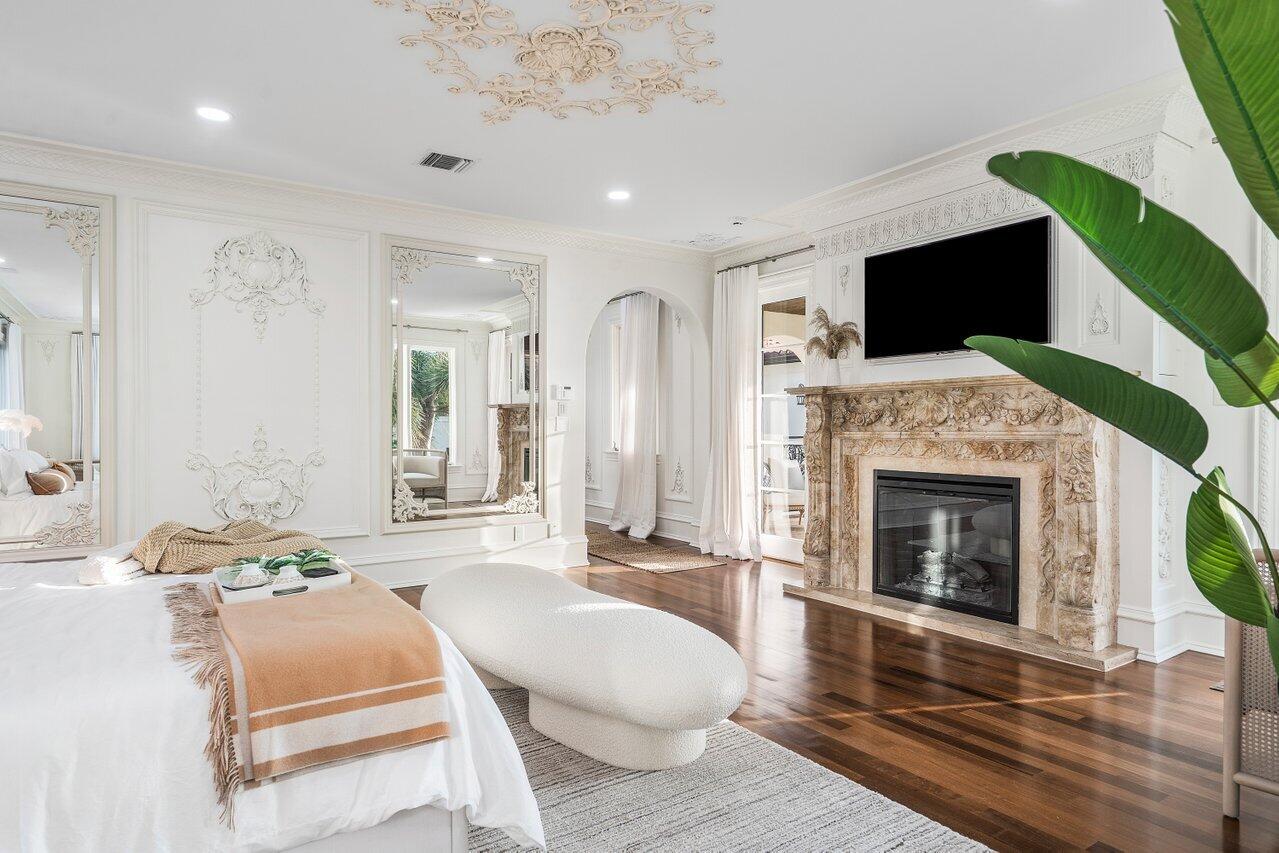 591 Phillips Drive Boca Raton, FL 33432 - Photo 35 of 90 a living room with furniture a flat screen tv and a fireplace