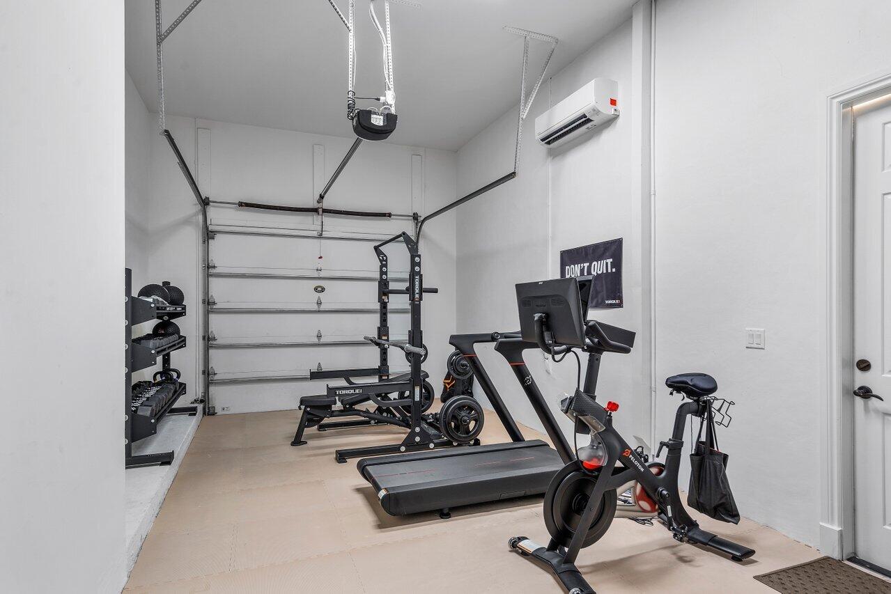 591 Phillips Drive Boca Raton, FL 33432 - Photo 49 of 90 a view of a room with gym equipment