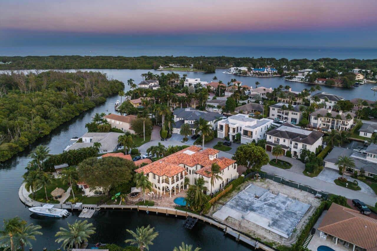 591 Phillips Drive Boca Raton, FL 33432 - Photo 5 of 90 an aerial view of residential houses with outdoor space and river