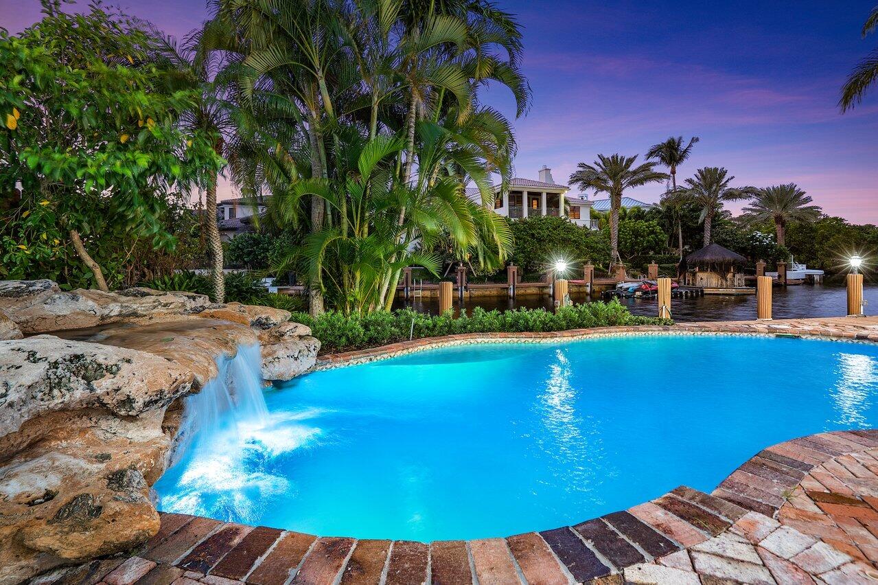 591 Phillips Drive Boca Raton, FL 33432 - Photo 78 of 90 a view of a swimming pool with an outdoor space and seating area
