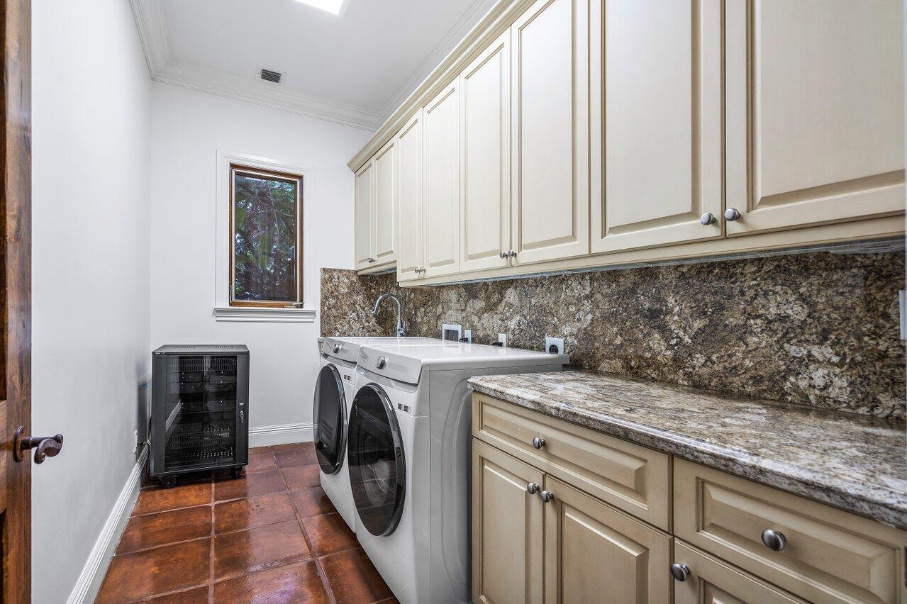 591 Phillips Drive Boca Raton, FL 33432 - Photo 79 of 90 a utility room with sink dryer and washer