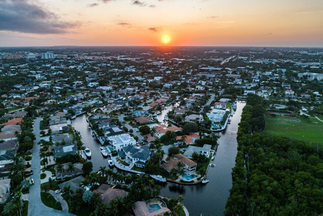 591 Phillips Drive Boca Raton, FL 33432 - Photo 87 of 90 an aerial view of residential houses with outdoor space and trees