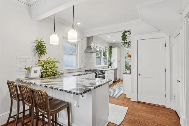 a kitchen with a table and chairs in it