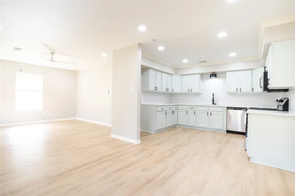 a view of kitchen with wooden floor