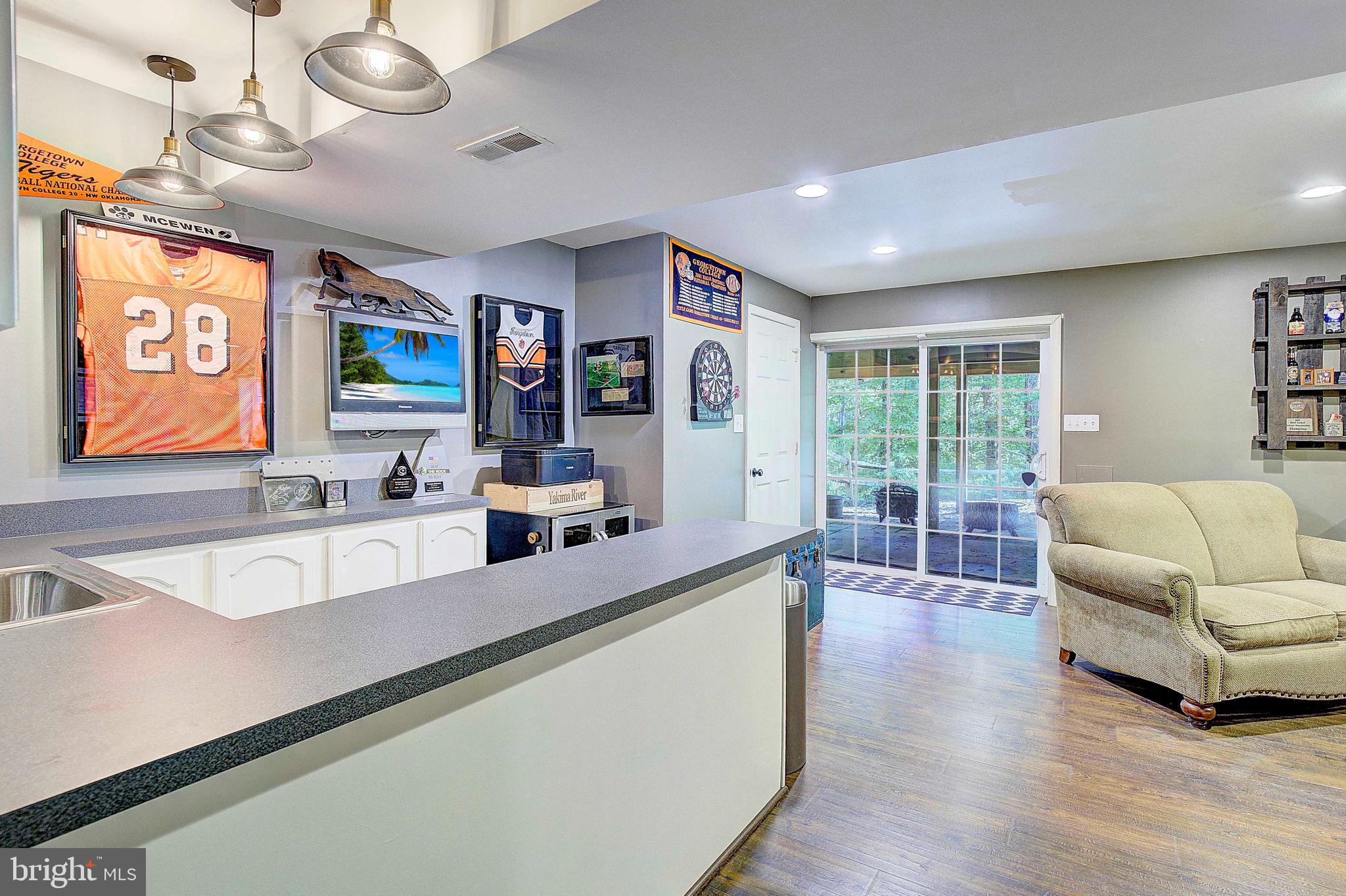 205 Walnut Creek Road Huntingtown, MD 20639 - Photo 31 of 48 a living room with stainless steel appliances kitchen island granite countertop furniture and a large window