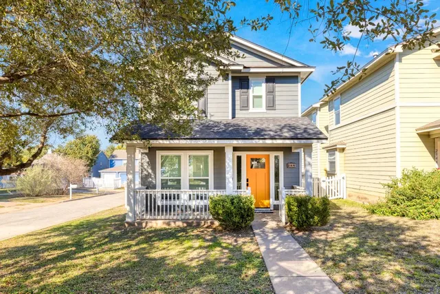a view of a house with a yard