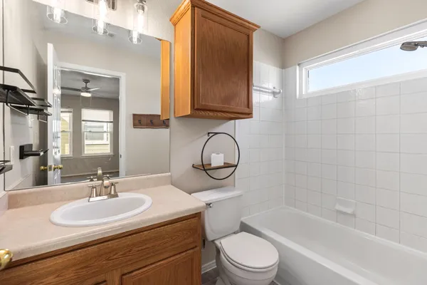 a bathroom with a sink a toilet and a bathtub