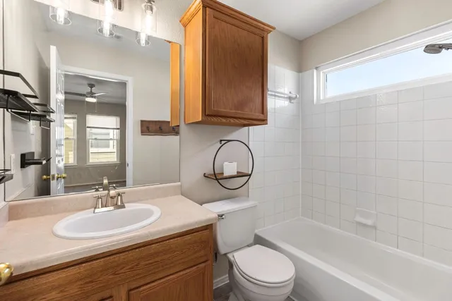 a bathroom with a sink a toilet and a bathtub
