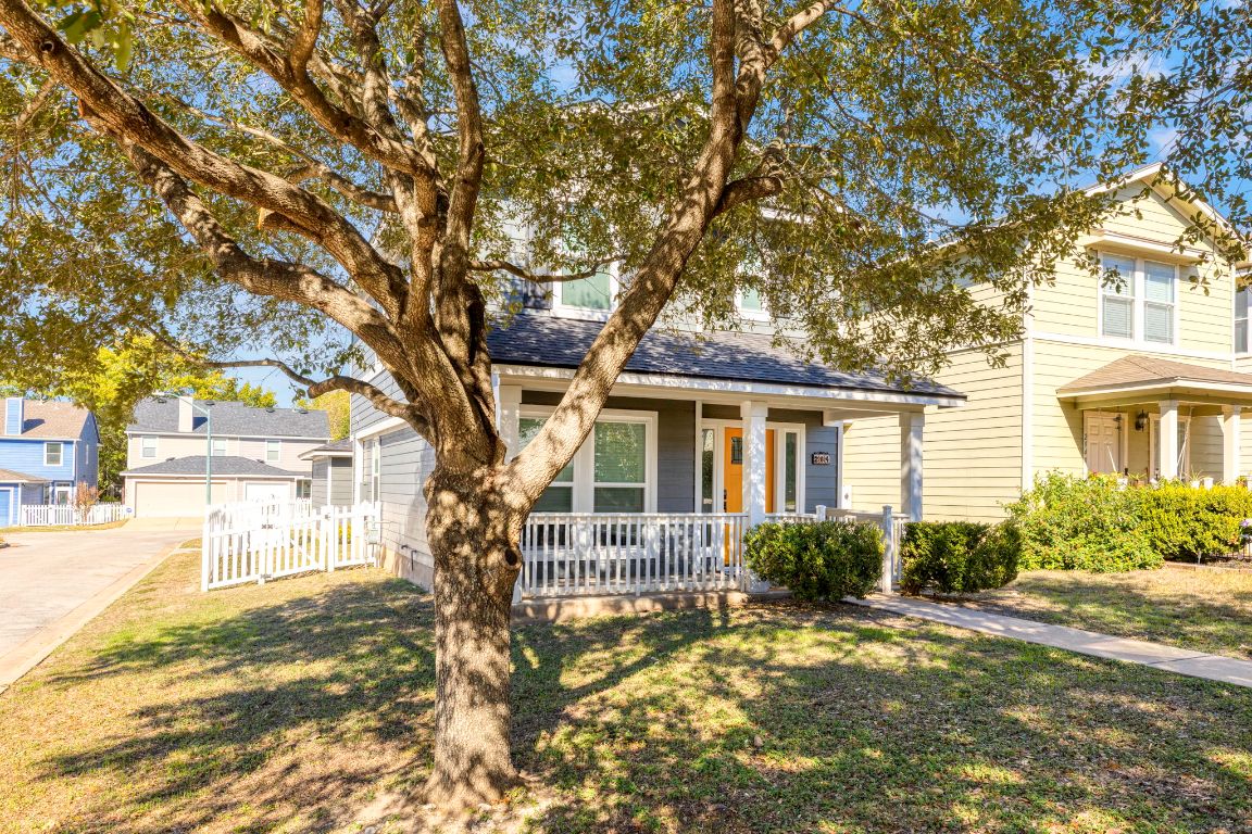 284 Michaelis Road Kyle, TX 78640 - Photo 2 of 20 a front view of a house with a yard