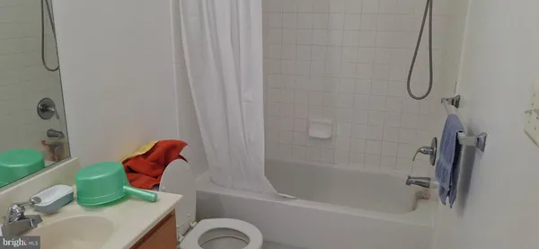 a kitchen with stainless steel appliances granite countertop a refrigerator and a stove