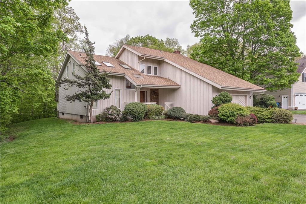 157 Tree Hill Road Berlin, CT 06037 - Photo 1 of 1 a front view of a house with a garden