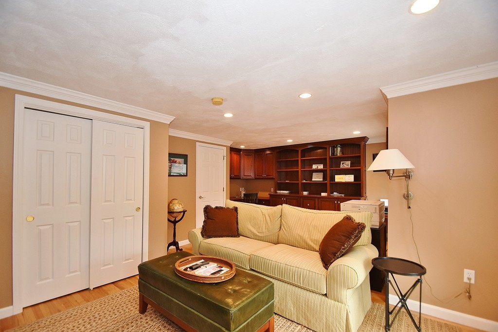 97 Hawthorne Village Road, Unit 97 Nashua, NH 03062 - Photo 15 of 30 a living room with furniture and wooden floor