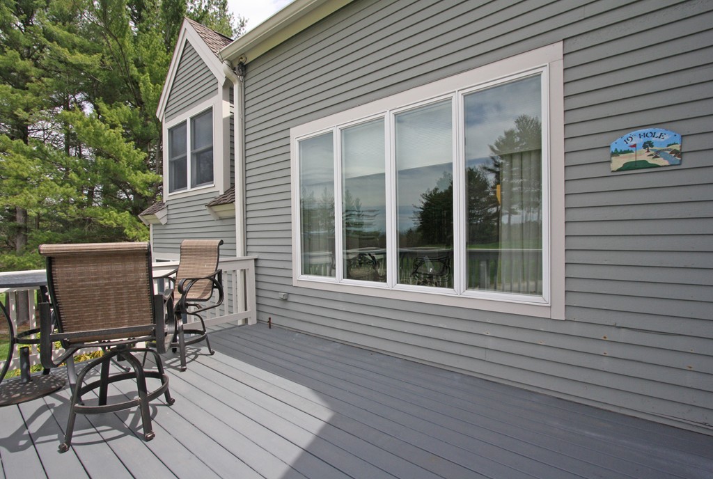 97 Hawthorne Village Road, Unit 97 Nashua, NH 03062 - Photo 26 of 30 a view of a house with sitting area