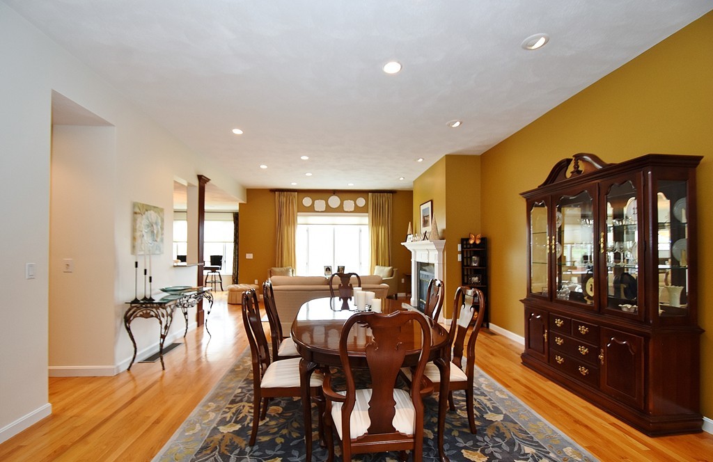 97 Hawthorne Village Road, Unit 97 Nashua, NH 03062 - Photo 6 of 30 a view of a dining room with furniture window and wooden floor