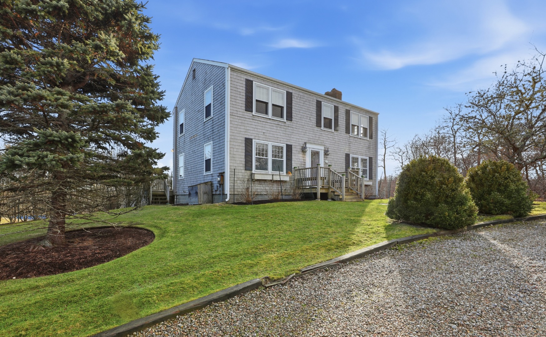 31 Flintlock Road Nantucket, MA 02554 - Photo 2 of 23 a front view of a house with a yard