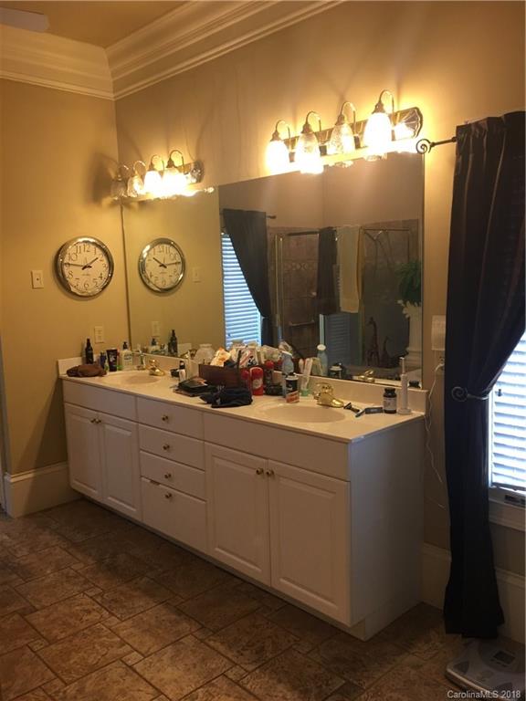 1801 Ruben Road Monroe, NC 28112 - Photo 14 of 14 a bathroom with a double vanity sink and a mirror