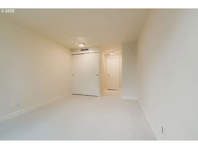 a view of a room that has a window in it