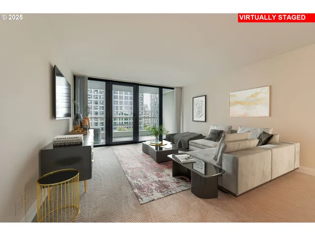 a living room with furniture and large windows