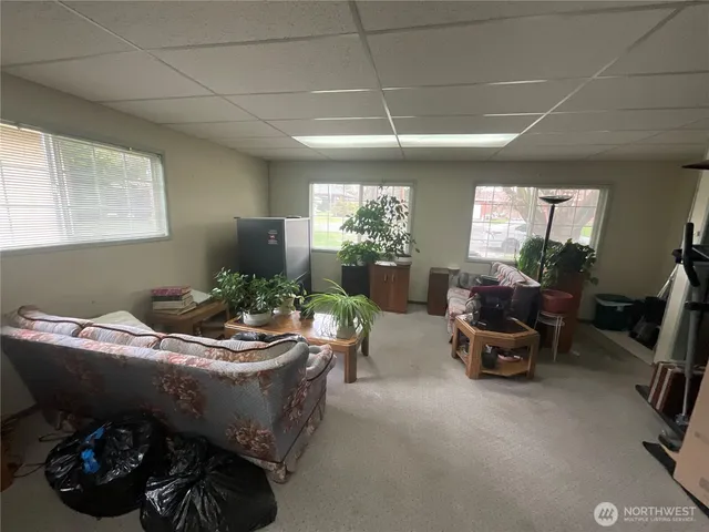 a room with furniture and gym equipment