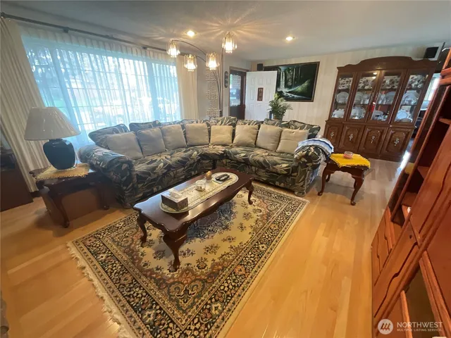 a living room with furniture and a rug