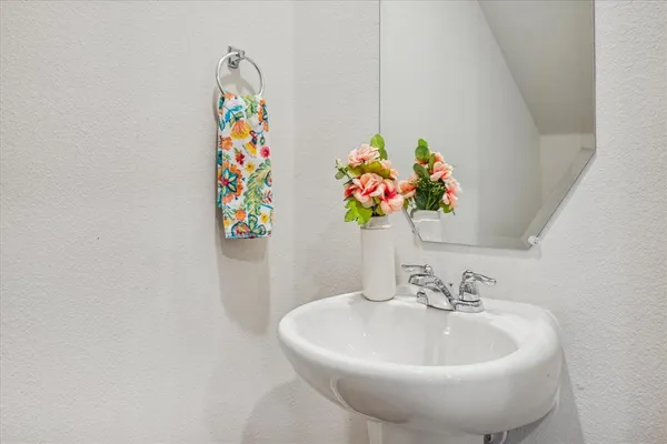 a bathroom with a sink and mirror